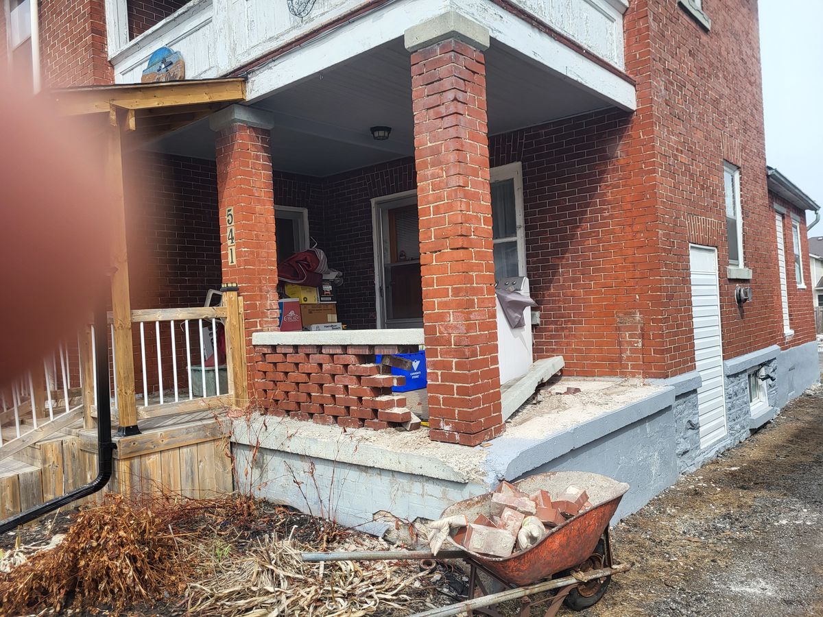 Failing brick porch before repair