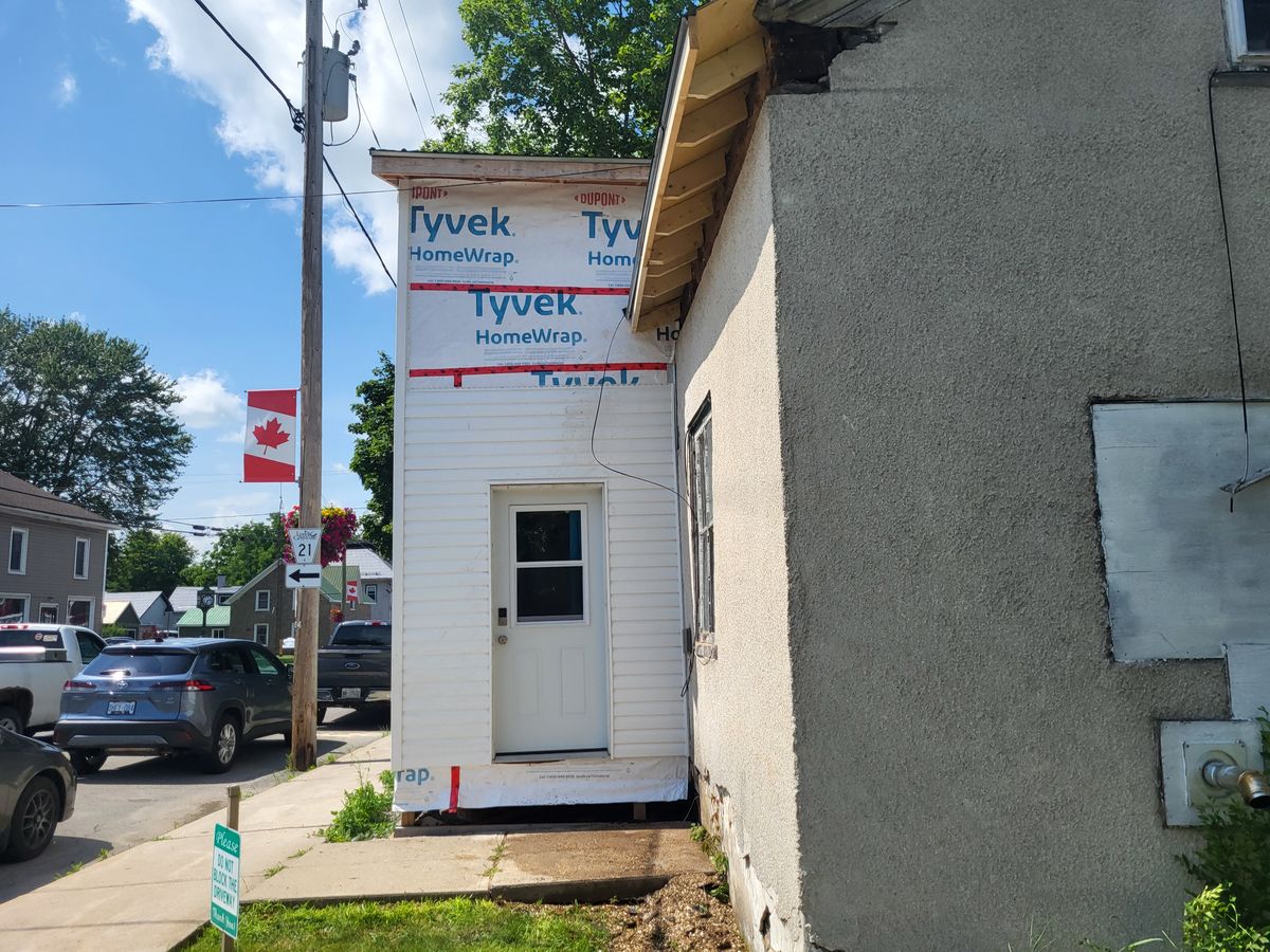 New exterior siding and door