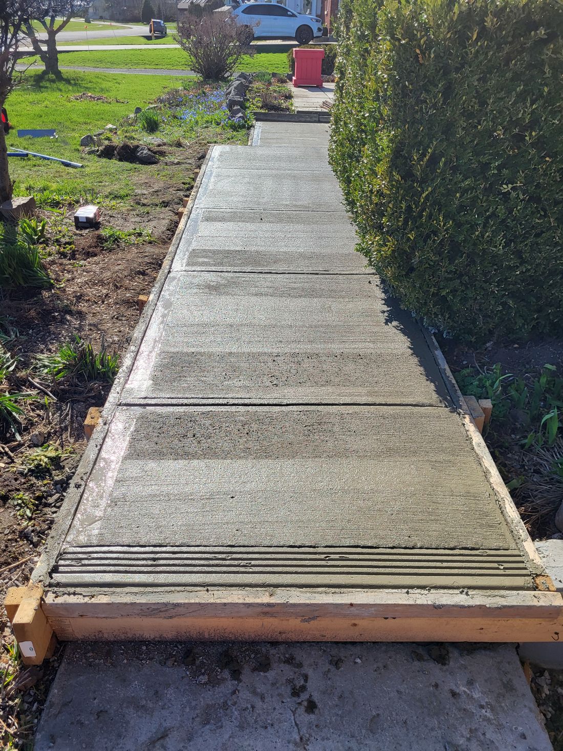 Finished concrete walkway by SG Assured Renovations